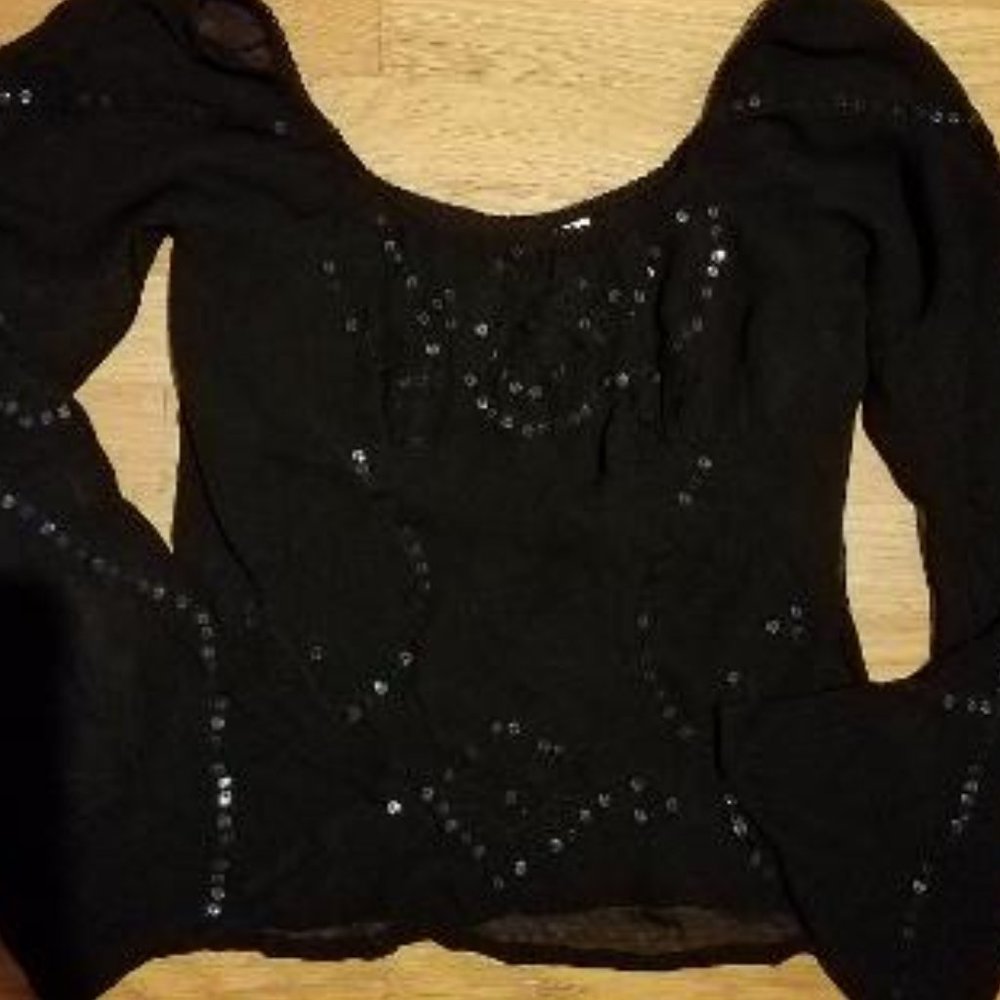 Black sequence airy shirt and black jaded skirt.